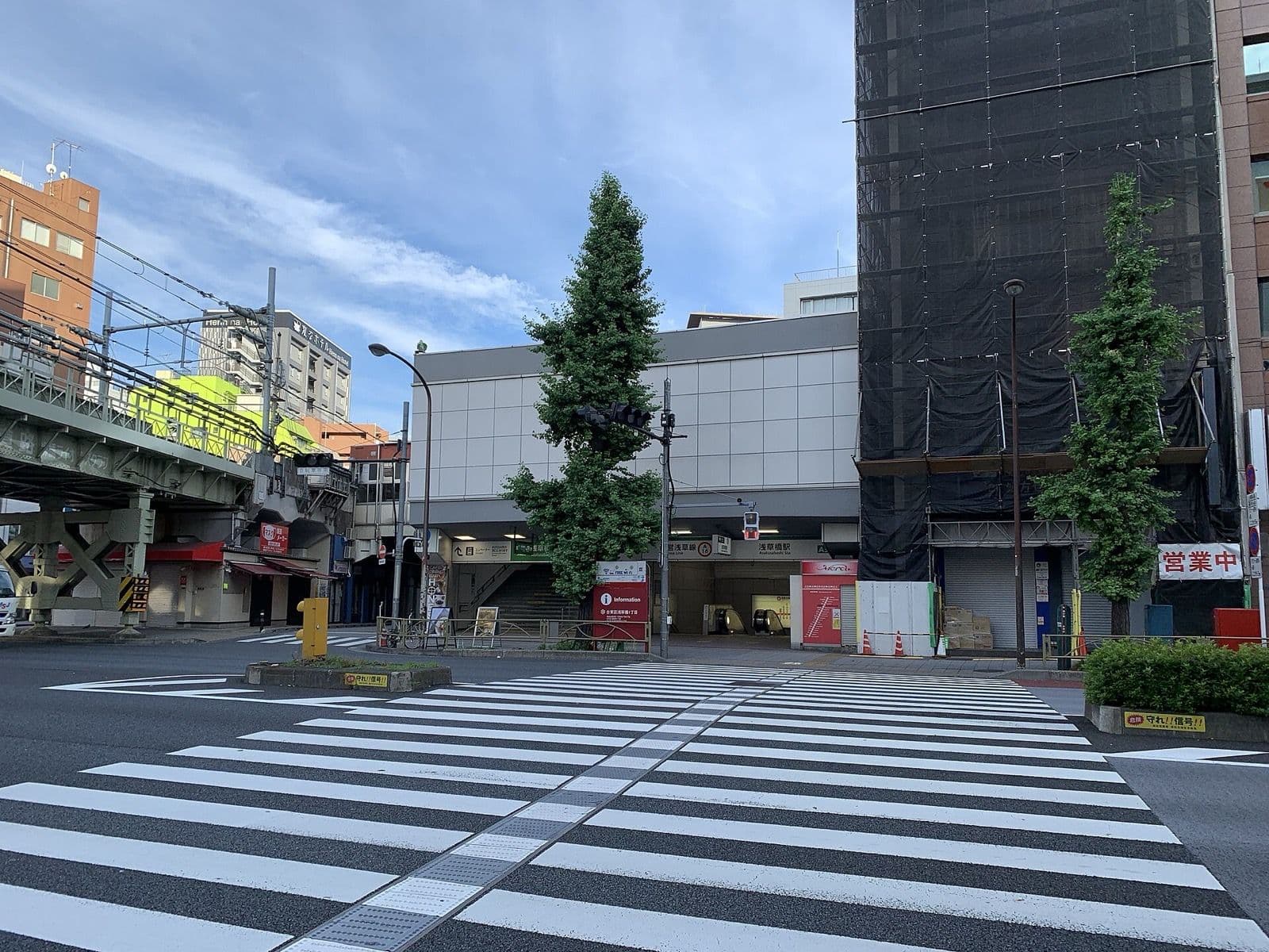 The Toei Asakusa Line entrance at Asakusabashi Station, with the JR Sobu Line viaduct on the left