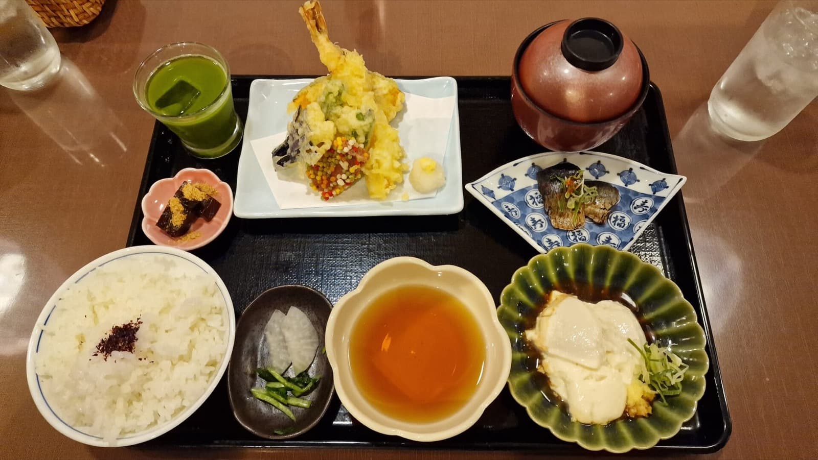 A kaiseki-style set meal on a tray, the kind of course that is prepared before guests arrive