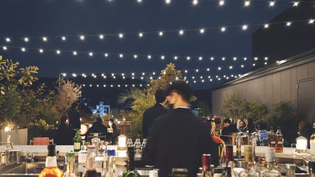 CICON rooftop bar at night — string lights, cocktails, and eastern Kyoto city glow